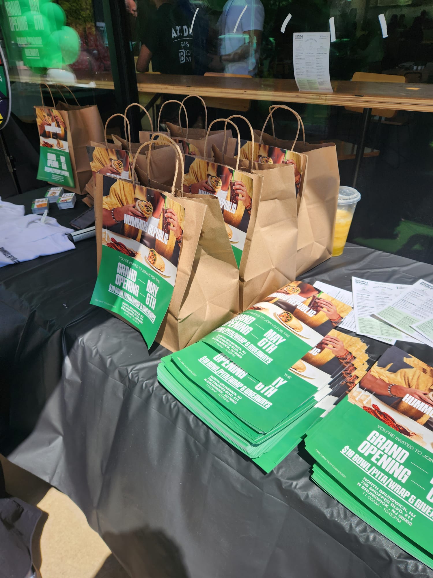 A franchise owner behind a fresh Mediterranean food counter demonstrating that how to buy a franchise with no experience is achievable with the right system behind you
