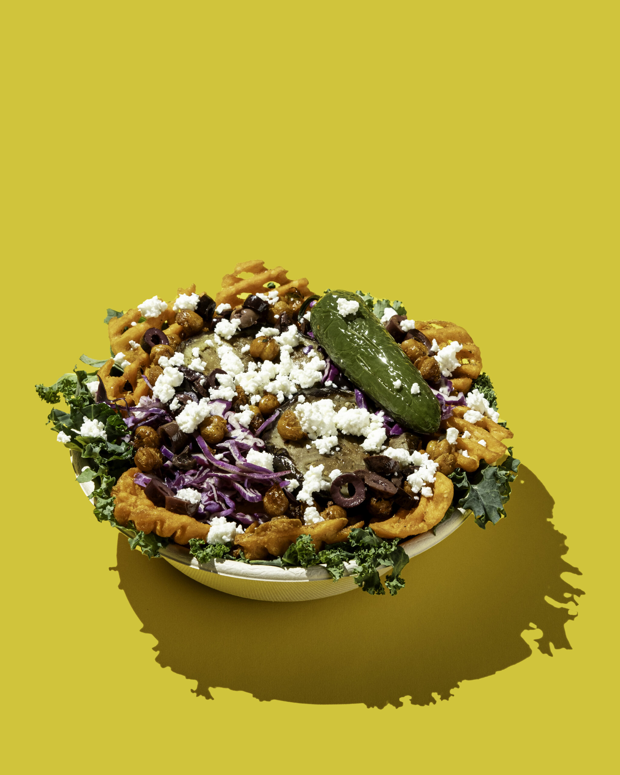 Fresh Mediterranean bowls at a fast-casual franchise counter illustrating what owners researching do you need a food handler license to own a franchise need to understand about food safety requirements