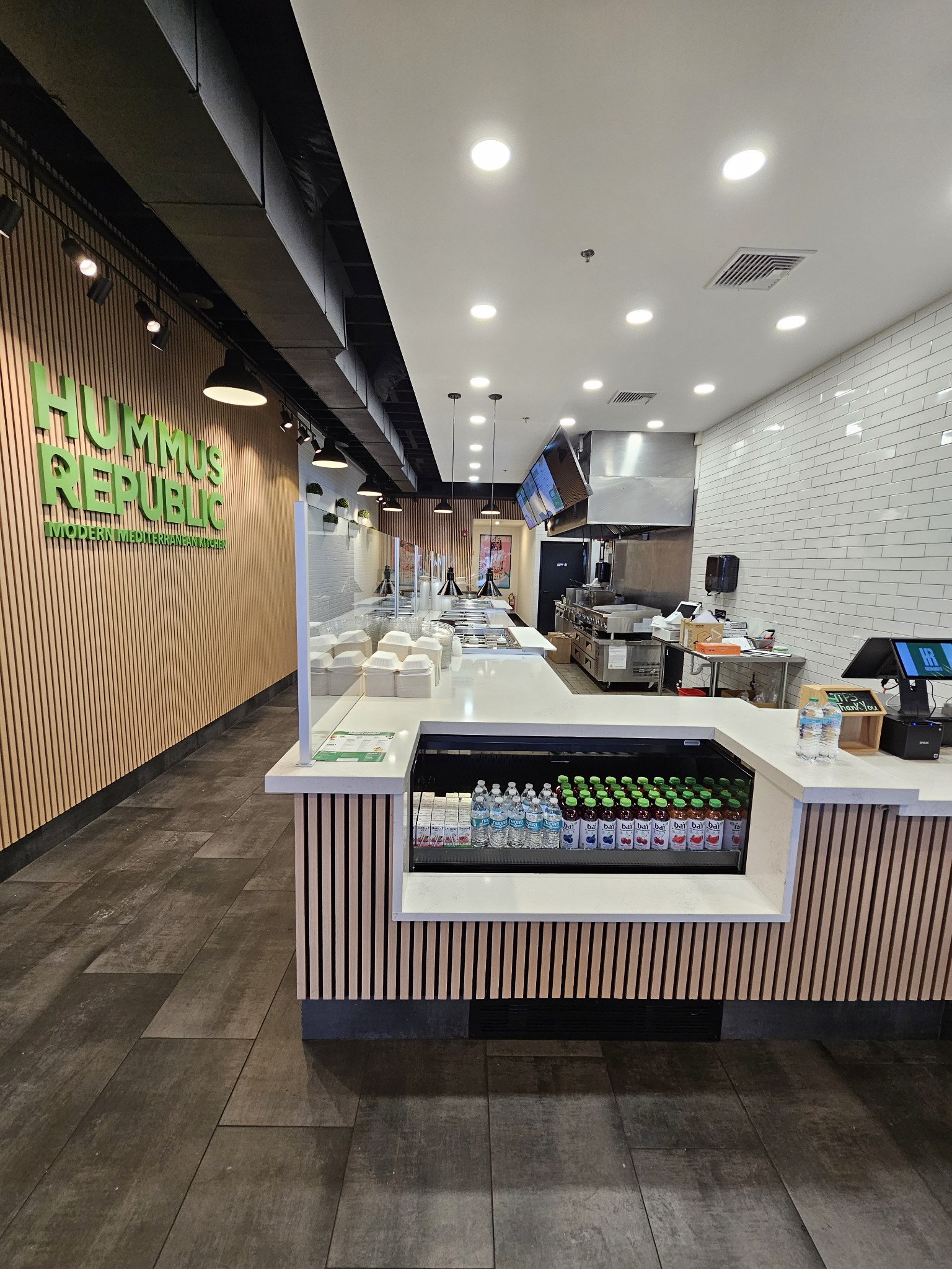 How to Build and Sell a Franchise for a Profit — What Buyers Actually Look For Fresh Mediterranean fast-casual counter spread showing hummus bowls and warm pita — the kind of brand built around how to build a profitable franchise to sell