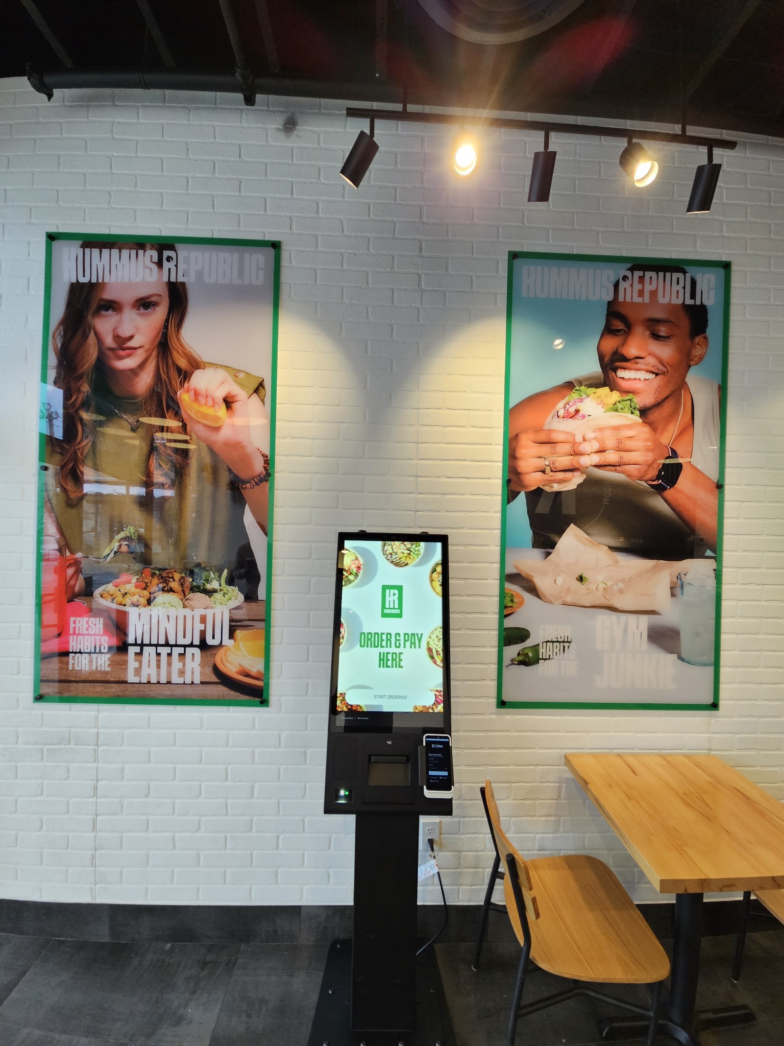 Fresh Mediterranean hummus bowls and falafel on a clean restaurant counter representing a genuine how to own a restaurant franchise with a full time job opportunity built for working professionals