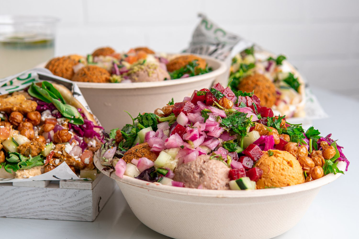 Why Mediterranean Food Is the Easiest Cuisine to Position as Healthy — Without Faking It a colorful spread of fresh Mediterranean fast casual dishes illustrating how to appeal to health conscious diners with whole ingredients like hummus, falafel, and tabbouleh on a wooden counter