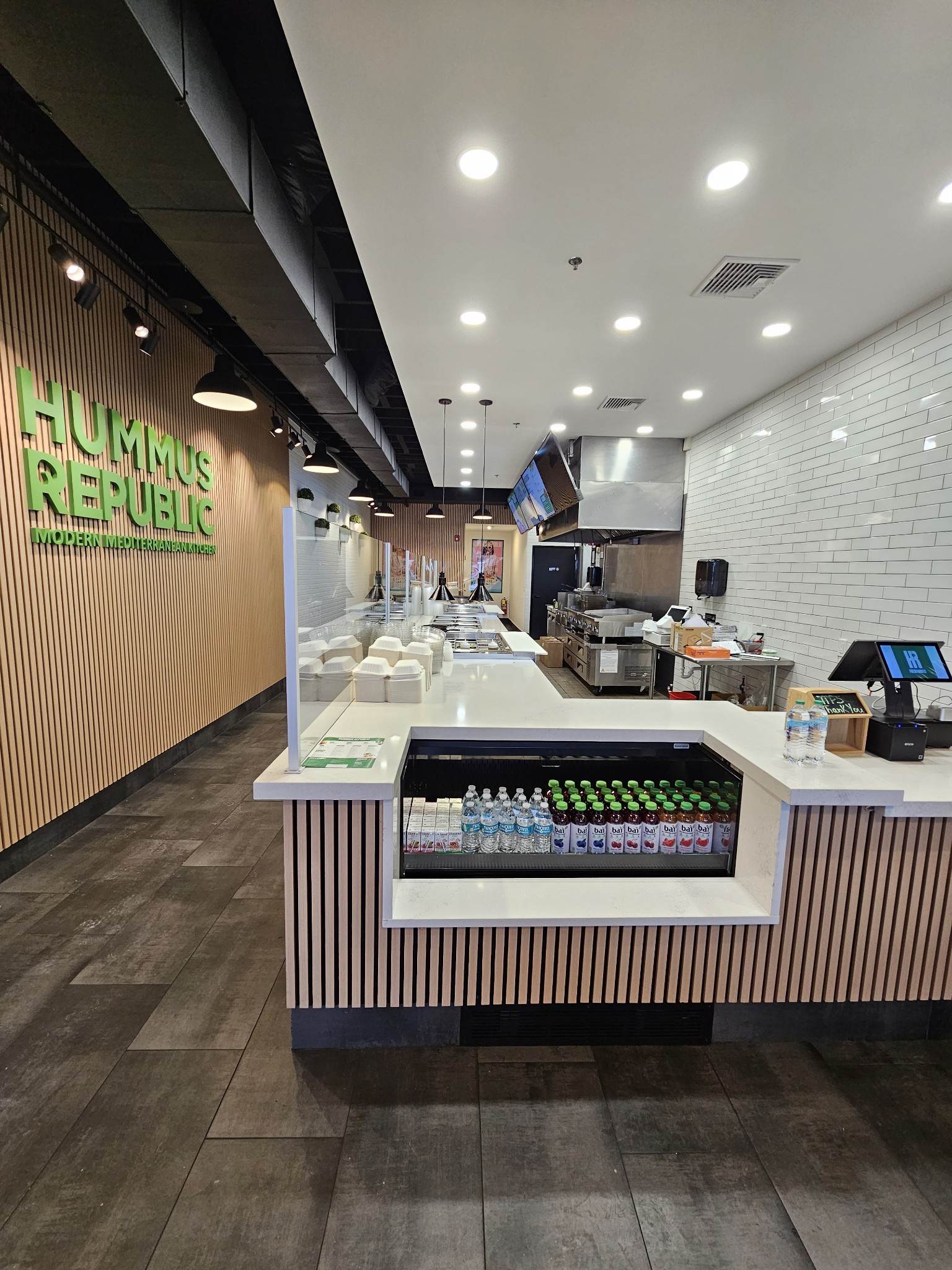 VA Loans and Veteran Business Grants for Franchise Ownership — What's Actually Available Freshly assembled Mediterranean grain bowls at a Hummus Republic counter illustrating the quality and concept behind pursuing a va loan for franchise purchase for franchise ownership
